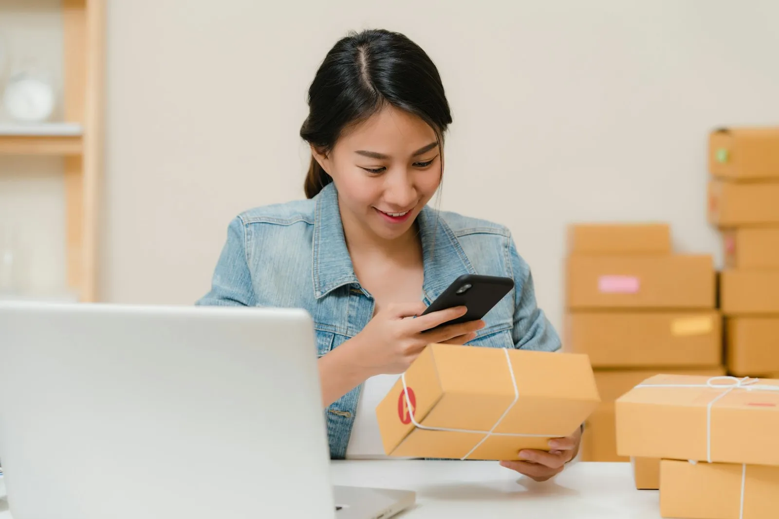 eCommerce operator reviewing multi-channel sales data on a laptop