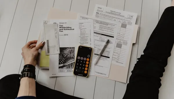Bill paperwork and calculator on a desk
